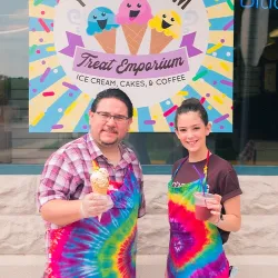 Chris Brady, Owner of You Scream Treat Emporium and an associate offer up some ice cream cones